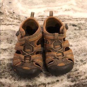 Brown little boy Keens